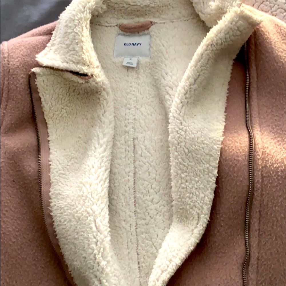 A light pink coat.